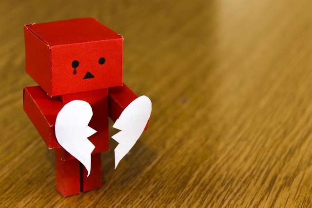 Figure holding Broken Heart