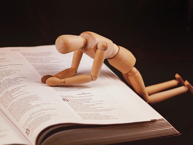 Wooden figurine in prayer