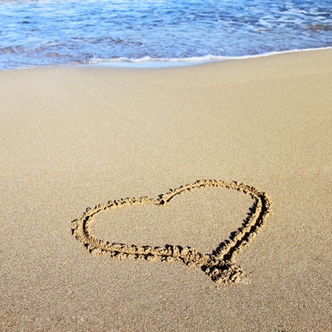 The disadvantage of youth - heart drawn in the sand