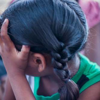 Little girl looking away from camera